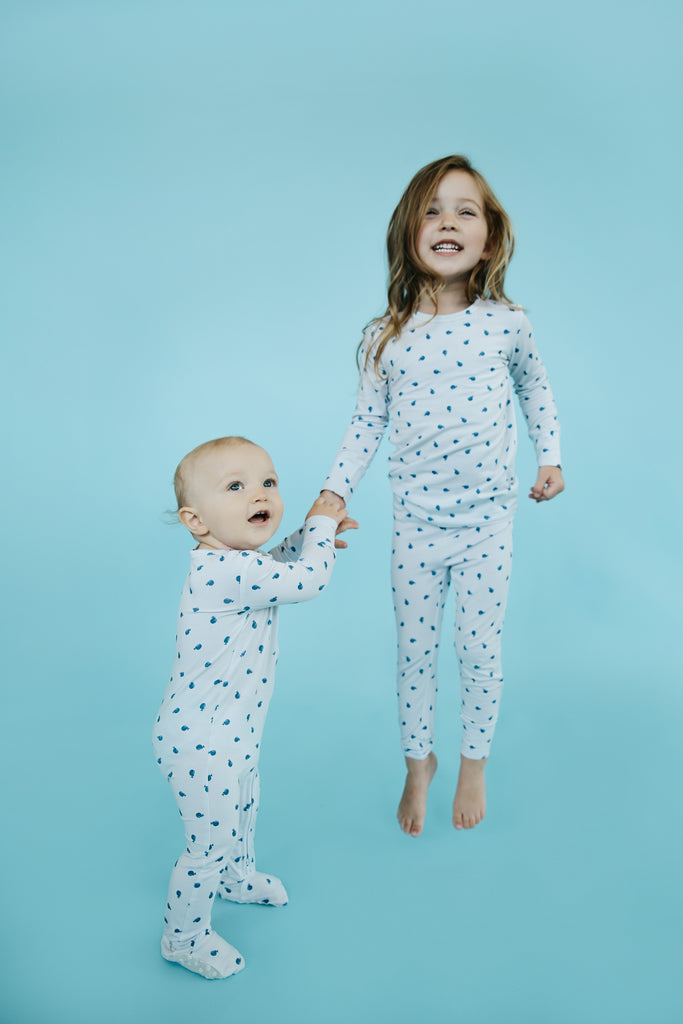 Siblings Jumping Around in Whale Print Sleepwear 