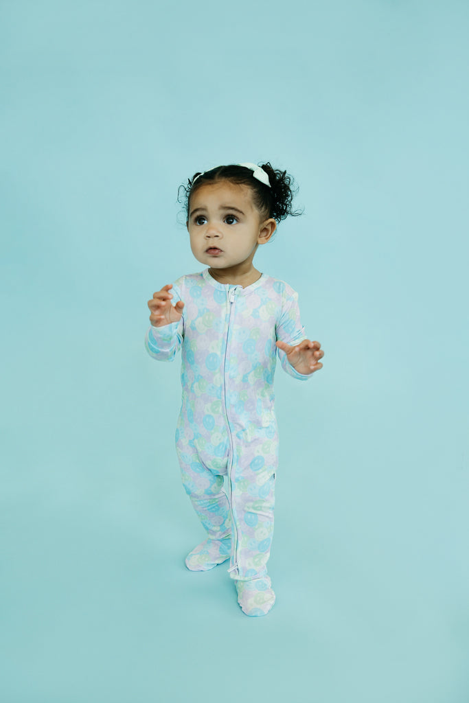 Cute Baby Standing in Soft Smilie Onesie 