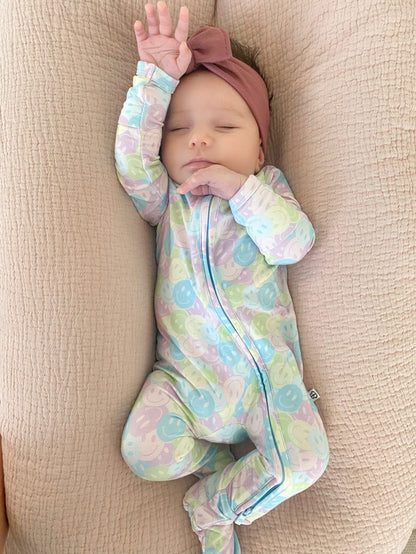 Baby Girl Sleeping in Pastel Smilie Face Onesie